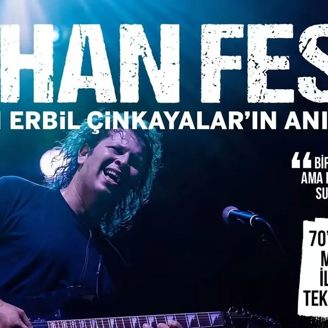 İLHAN FEST poster: İlhan Erbil Çınkayalar with long curly hair playing electric guitar under blue stage light; memorial festival with 70+ musicians