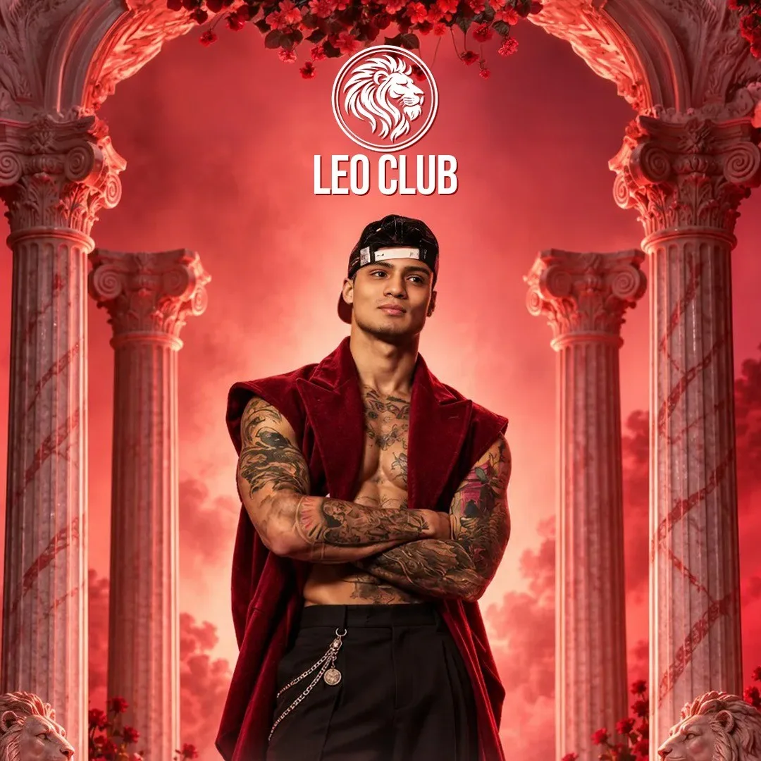 Çakal in a red sleeveless jacket and cap between marble columns, Leo Club lion logo above