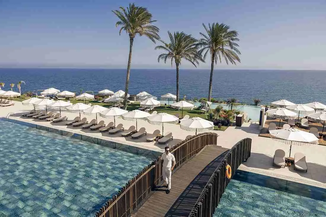 Merit Park Hotel pools and sun loungers by the sea